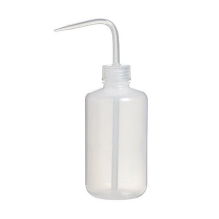 Bottle with L-shaped dispenser.